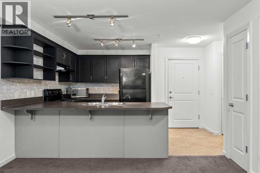 #1213, 310 McKenzie Towne Gate SE - Photo 4
