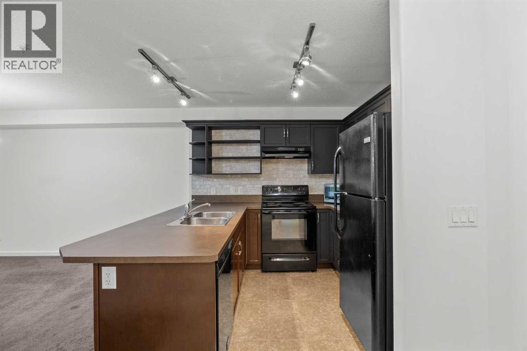 #1213, 310 McKenzie Towne Gate SE - Photo 5