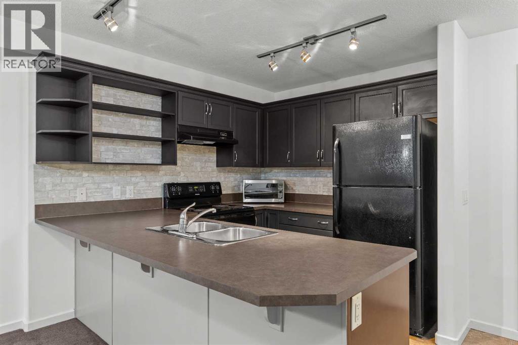 #1213, 310 McKenzie Towne Gate SE - Photo 6